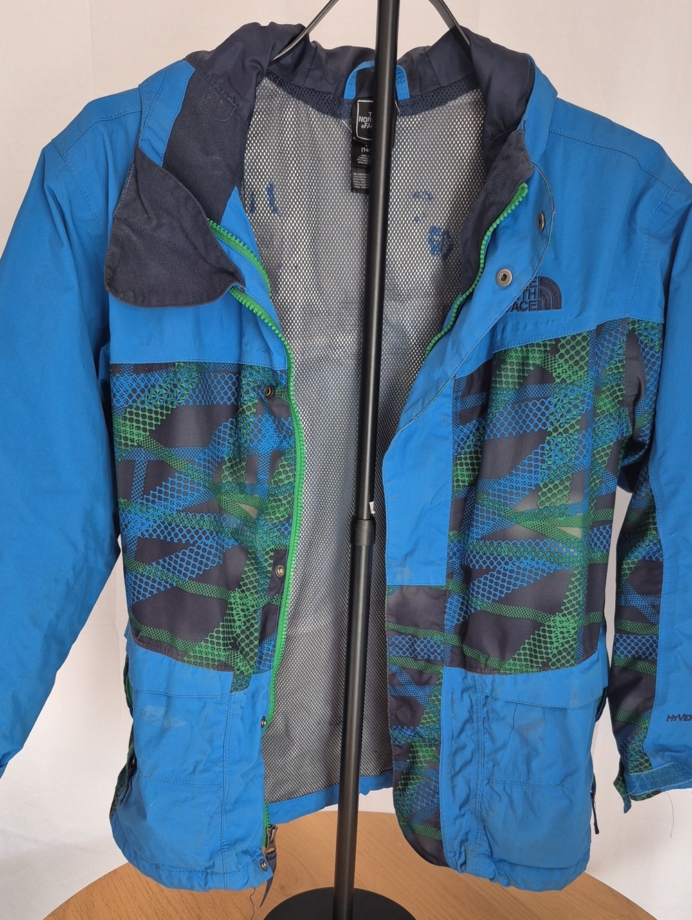 The North Face Blue Jacket with Green Patterned Accents